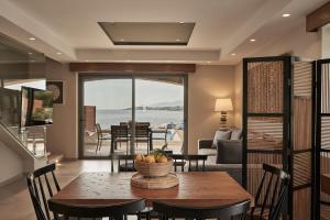 A seating area at Beachfront Alassa Villas with Private Pools