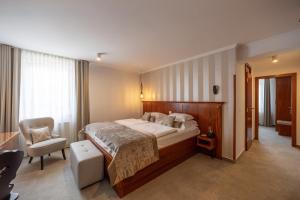 Postel nebo postele na pokoji v ubytování Kotnik Superior Boutique Hotel