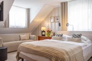 Postel nebo postele na pokoji v ubytování Kotnik Superior Boutique Hotel