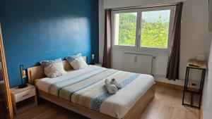 Postel nebo postele na pokoji v ubytování Appart'Hotel Lizon Cocooning avec sauna