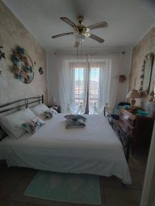 Postel nebo postele na pokoji v ubytování Casa Claudia Villasimius