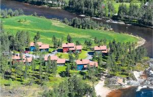 an aerial view of a house on a hill with trees at Gaupe - Hytte 5 in Øvre Ramse +19 photos