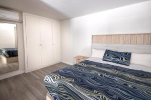 Posteľ alebo postele v izbe v ubytovaní PREMIUM MALAGUETA SUITE