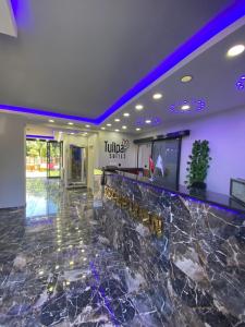 a lobby of a hotel with a marble counter at TULİPA SUİTEs TRABZON in Bostancı