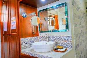 a bathroom with a sink and a mirror at Casa Del Faro in Puerto Galera +87 photos