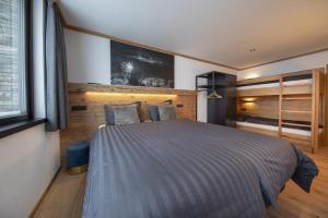 a bedroom with a large bed in a room at Edelweisshaus Top 2 in Königsleiten