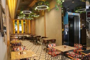 a restaurant with tables and chairs in a room at AMARA OLD CITY HOTEL & Spa in Istanbul