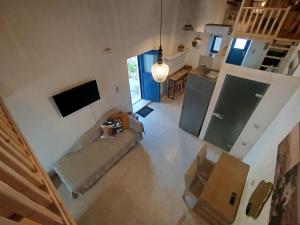 an overhead view of a living room with a couch at Grandpa's place in Lagoúdi Zía
