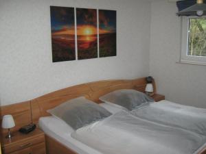 a bedroom with a bed with two pillows at Gemütliche Wohnung in Goldhausen mit Großem Balkon und Panoramablick in Korbach