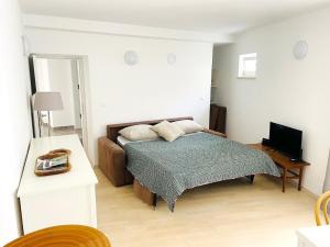 Ένα ή περισσότερα κρεβάτια σε δωμάτιο στο Appartement in Baška mit Terrasse +7 φωτογραφίες