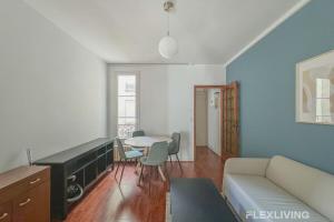 a living room with a couch and a table at Flexliving - room - Lindet in Paris