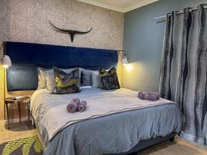 Tzamenkomst River Lodge客房内的一张或多张床位