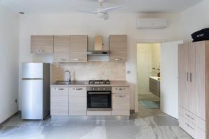 Køkken eller tekøkken på Casa Vacanza Mario 2D a 180 mt dal mare di Punta Prosciutto + 12 billeder