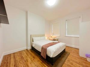 Voodi või voodid majutusasutuse Millers Point Waterview toas