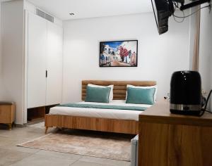 Postel nebo postele na pokoji v ubytování Hôtel Suisse Tunis