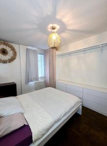 Ένα ή περισσότερα κρεβάτια σε δωμάτιο στο APPARTEMENT T2 Spacieux et lumineux
