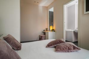 Postel nebo postele na pokoji v ubytování Hotel Ines