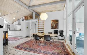 a dining room with a table and chairs at Beautiful Home In Vestervig With Sauna in Vestervig