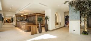 a lobby of a store with a counter at Ilunion Caleta Park in Sant Feliu de Guixols