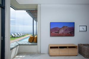 a living room with a view of the ocean at Taaibosch Collection in Stellenbosch