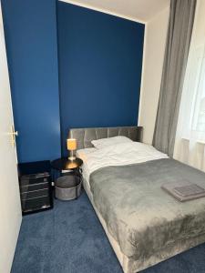 Ένα ή περισσότερα κρεβάτια σε δωμάτιο στο N&L Apartments