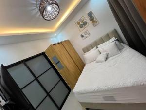 Ένα ή περισσότερα κρεβάτια σε δωμάτιο στο Serene Mia Casa