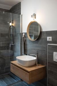 a bathroom with a sink and a mirror at Relax Home Funtana in Funtana +53 photos