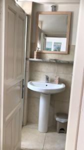 a bathroom with a sink and a mirror at Porta Mare rooms 1 in Otranto