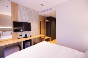 Postel nebo postele na pokoji v ubytování Tris3 Hotel