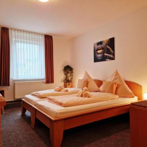 Postel nebo postele na pokoji v ubytování DM Hotels & Apartments - Zum Unstrut Radler