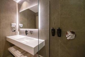 Koupelna v ubytování Tris3 Hotel