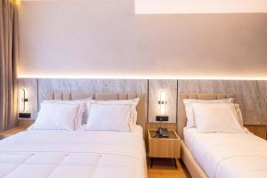 Postel nebo postele na pokoji v ubytování Tris3 Hotel