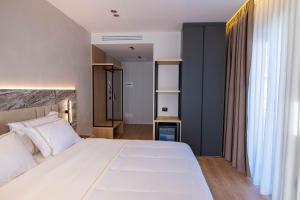Postel nebo postele na pokoji v ubytování Tris3 Hotel + 37 fotografií