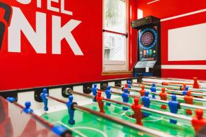 a group of lego tables in a room with a nk sign at Hostel Link in Lovran