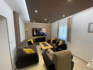 a living room with a couch and a table at Kuća za odmor Mariola in Karlovac