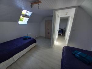 Postel nebo postele na pokoji v ubytování Gîte entre Mer et Abers