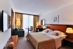 Postel nebo postele na pokoji v ubytování Hotel Princess