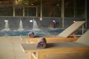 a swimming pool with two lounges and a swimming pool at Inmood Aucanada 4 Sup in Port d'Alcudia