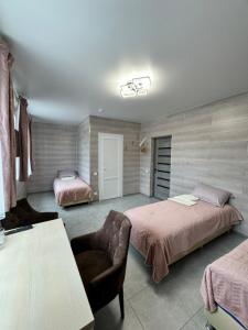 Postel nebo postele na pokoji v ubytování Hotel TETRIS Voznesensk