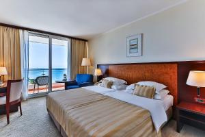 Postel nebo postele na pokoji v ubytování Hotel Princess