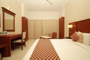Postel nebo postele na pokoji v ubytování Hotel DSF Grand Plaza
