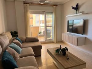 Μια τηλεόραση ή/και κέντρο ψυχαγωγίας στο Vista Marina Apartment La Manga