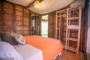 a bedroom with two bunk beds and a ladder at Procida Camp & Resort - La Caravella in Procida +124 photos