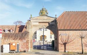 an entrance to a brick building with an archway at 1 Bedroom Nice Apartment In Barth in Barth