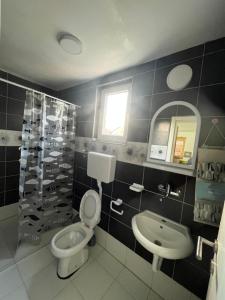 Koupelna v ubytování Rooms Asceric