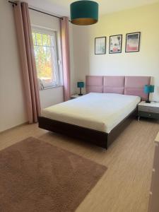 Postel nebo postele na pokoji v ubytování Domek Łeba Nowęcin