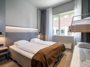Postel nebo postele na pokoji v ubytování Quality Hotel Saga