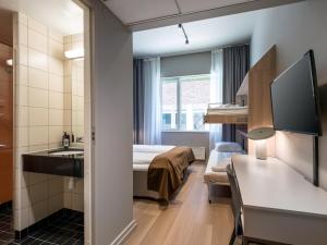 Postel nebo postele na pokoji v ubytování Quality Hotel Saga