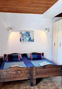 Posteľ alebo postele v izbe v ubytovaní Apartmani E&G