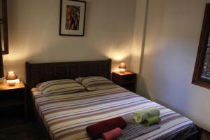 Postel nebo postele na pokoji v ubytování Alice House